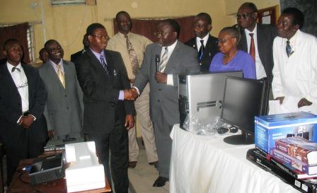 Provost, Prof. O. A. Atoyebi thanking and receiving E-Library donation from Dr. E. B. John