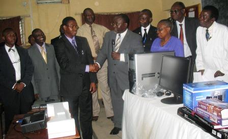 Provost, Prof. O. A. Atoyebi thanking and receiving E-Library donation from Dr. E. B. John Provost, Prof. O. A. Atoyebi thanking and receiving E-Library donation from Dr. E. B. John